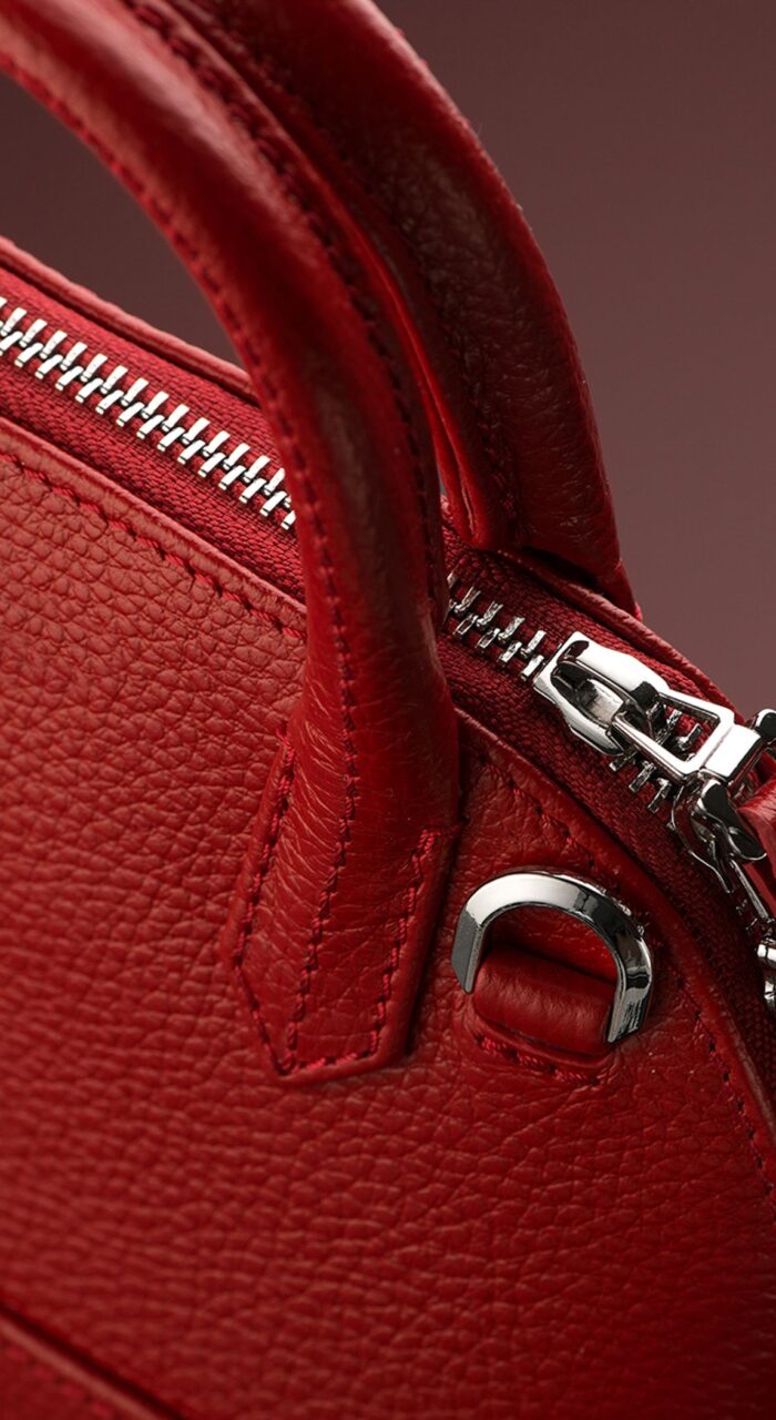 Closeup shot of a luxury red leather bag